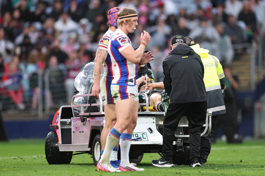 Phoenix Crossland is called out by the referee as Nathan Cleary is taken off the field on a medicab.