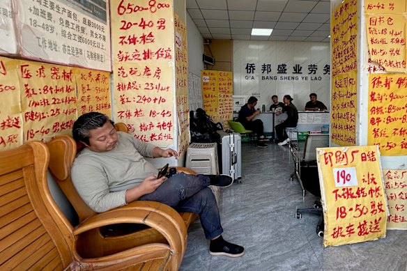 Handwritten job ads line the walls of a labour-hire agency in Majuqiao.