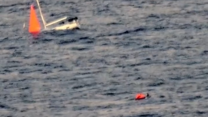 Sailors rescued from raft after hitting a whale pod sinks their yacht