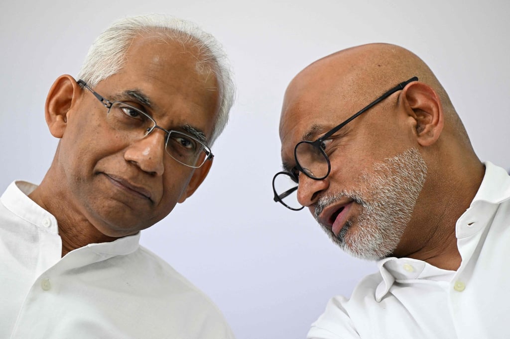 Sri Lanka cricket transformation committee chairman Eran Wickramaratne (left) speaks with secretary Prakash Schaffter during a press conference at the Sri Lanka Cricket Board office in Colombo. Photo: AFP