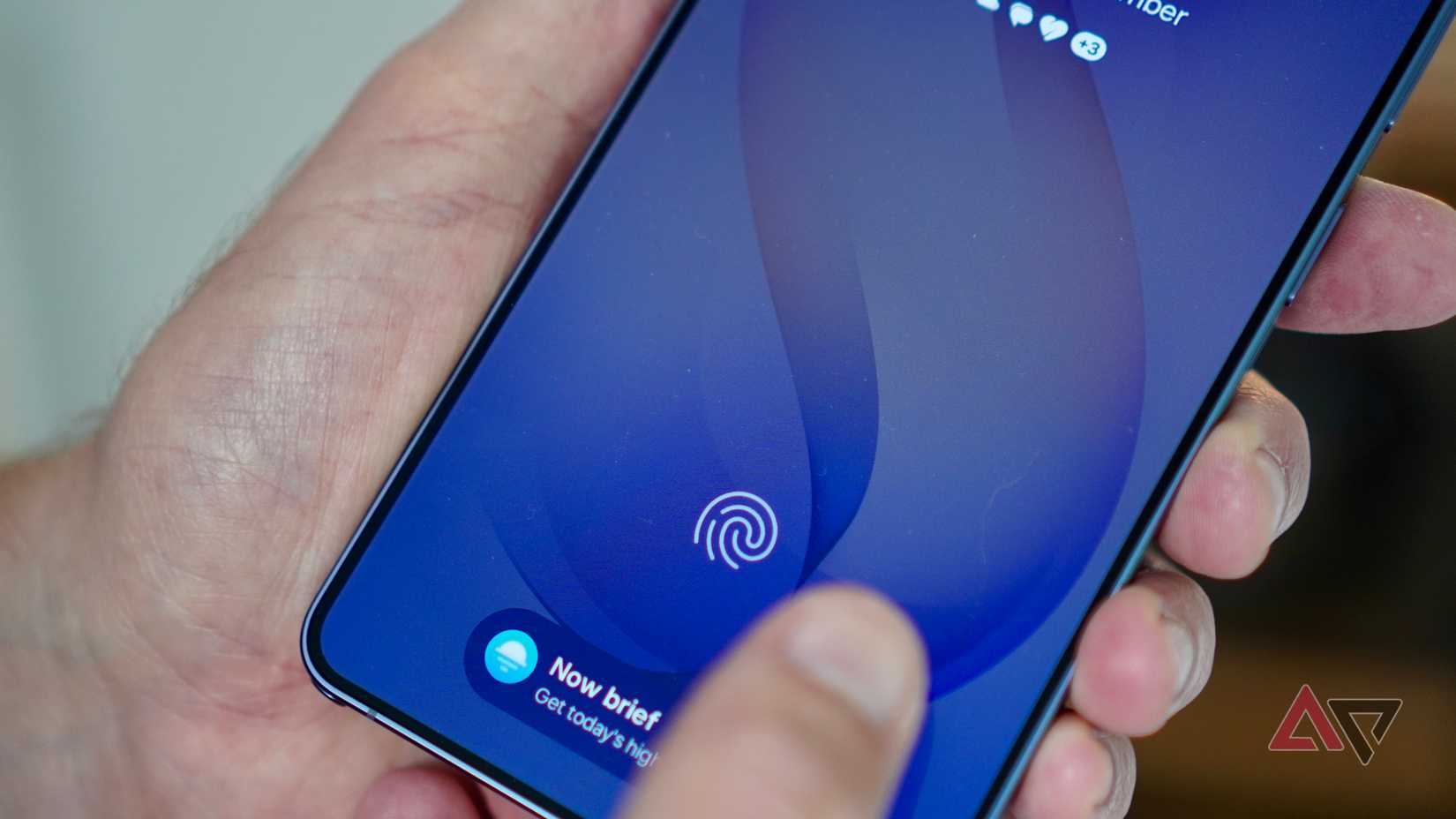 A person using the fingerprint sensor on the Samsung Galaxy Z Fold 8 Ultra