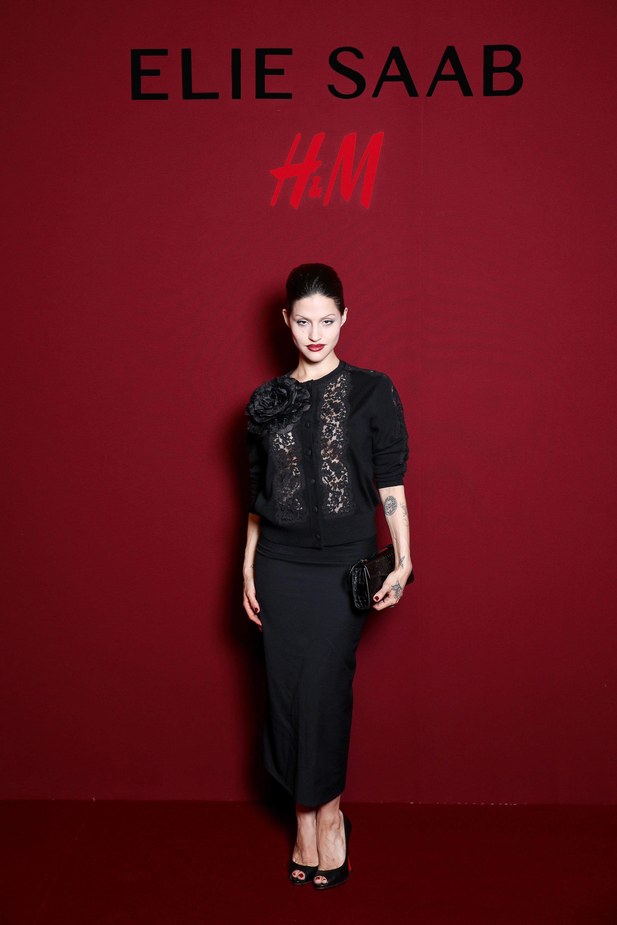 Gabbriette in a black outfit poses at the H&M Elie Saab VIP event.