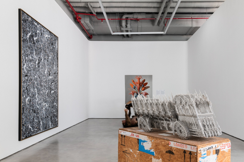 dubai gallery pairs open white exhibition halls with a concealed, brick-toned museum room - 3