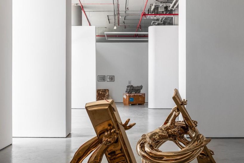 dubai gallery pairs open white exhibition halls with a concealed, brick-toned museum room - 7