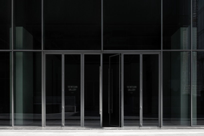 dubai gallery pairs open white exhibition halls with a concealed, brick-toned museum room - 1