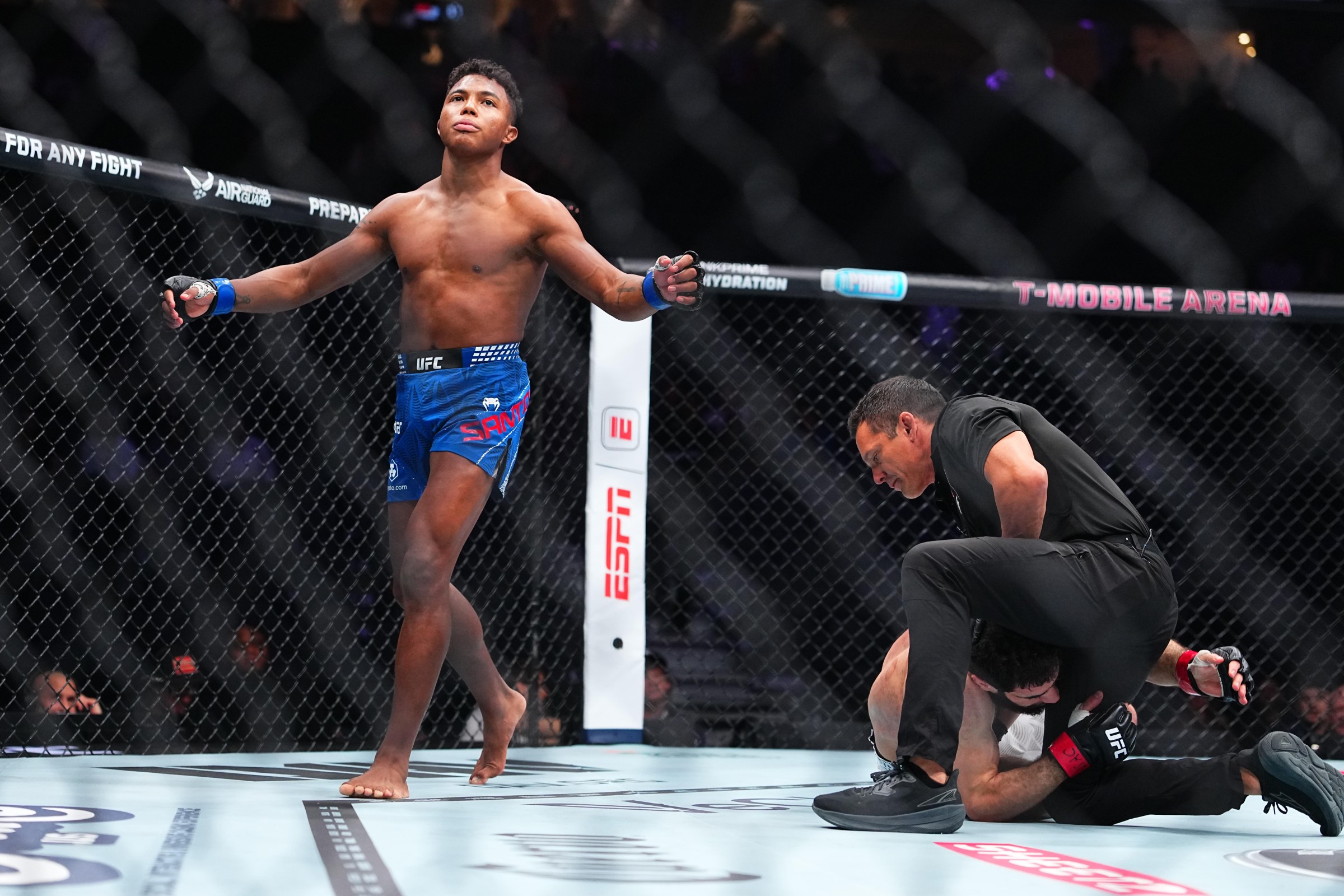 LAS VEGAS, NEVADA - DECEMBER 06: Mairon Santos of Brazil reacts to his knockout of Muhammad Naimov of Tajikistan in a featherweight fight during the UFC 323 event at T-Mobile Arena on December 06, 2025 in Las Vegas, Nevada. (Photo by Chris Unger/Zuffa LLC)