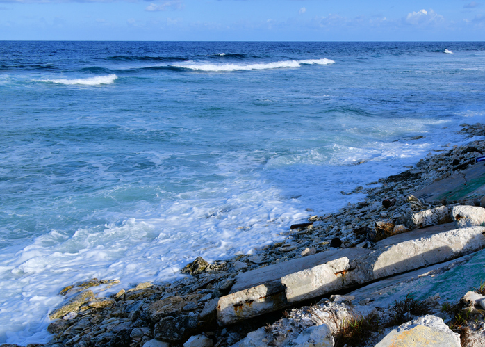 The remains of a collapsed seawall due to rising sea levels in Tuvalu in the Pacific.