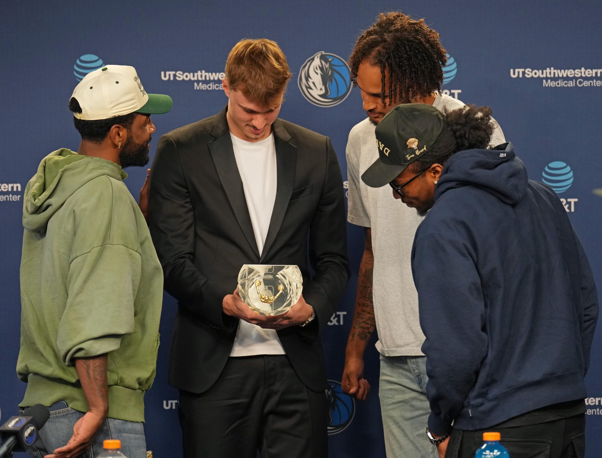 DALLAS, TX - APRIL 29: Cooper Flagg #32 of the Dallas Mavericks poses for a photo with Kyrie Irving #11 and Dereck Lively II #2 during the 2026-26 Rookie of the Year Presentation on April 29, 2026 at American Airlines Center in Dallas, Texas. NOTE TO USER: User expressly acknowledges and agrees that, by downloading and or using this photograph, User is consenting to the terms and conditions of the Getty Images License Agreement. Mandatory Copyright Notice: Copyright 2026 NBAE (Photo by Glenn James/NBAE via Getty Images)