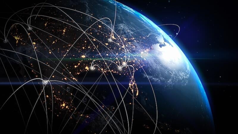 earth from space at night with sweeping network lines