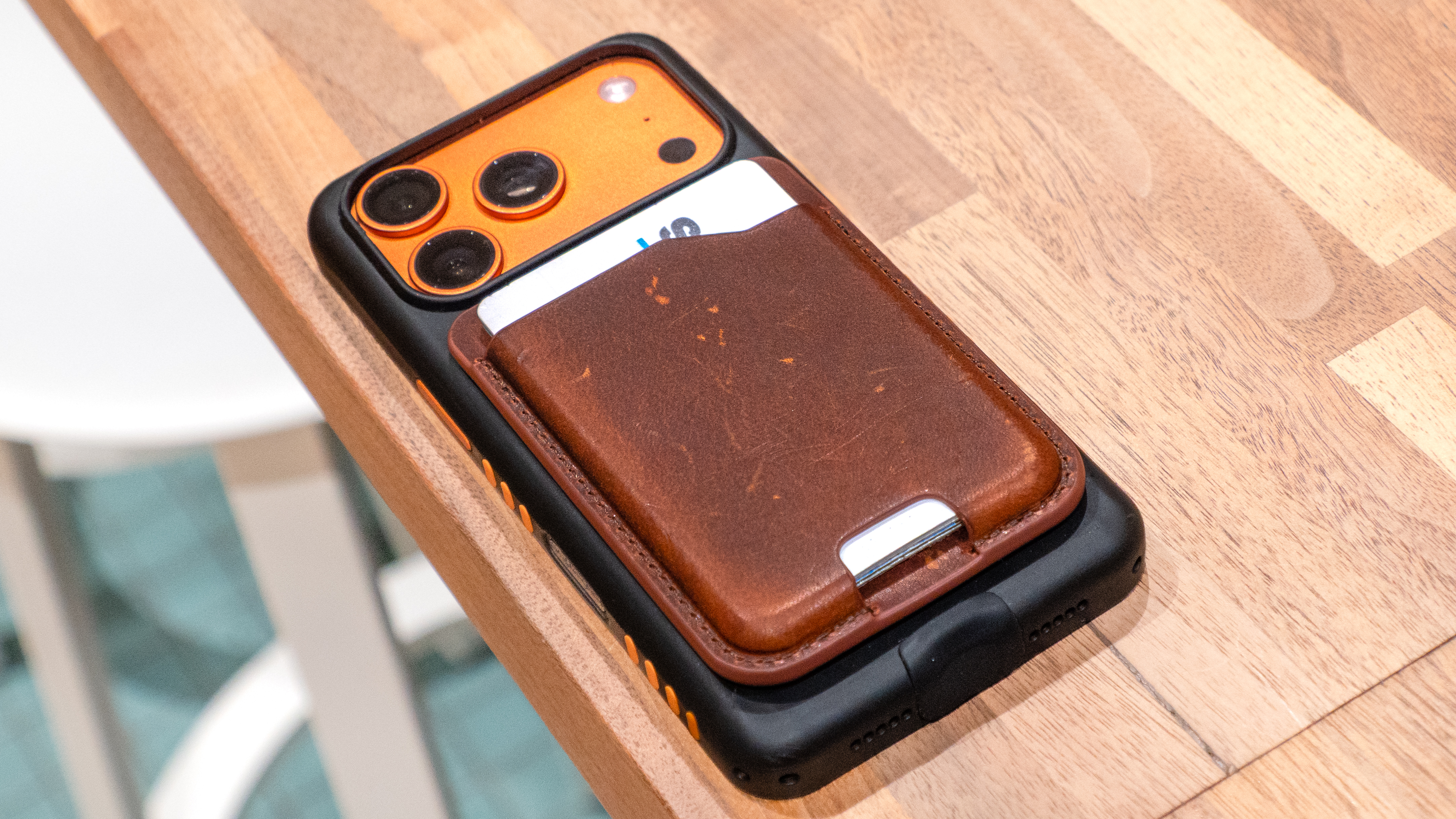 Nomad Leather Mag Wallet on iPhone 17 Pro case.