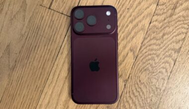 An iPhone on a wood surface