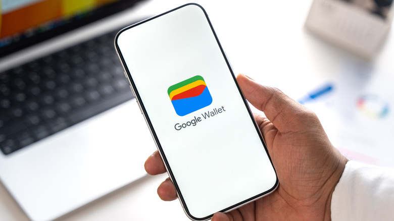 The Google Wallet logo, displayed centrally on an Android smartphone