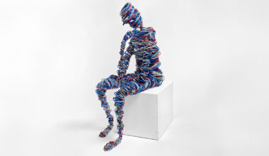 hundreds of feet of network cable and steel reimagine rodin’s thinker