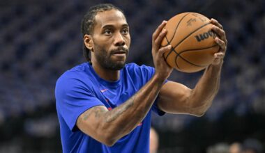 Kawhi Leonard holds a ball
