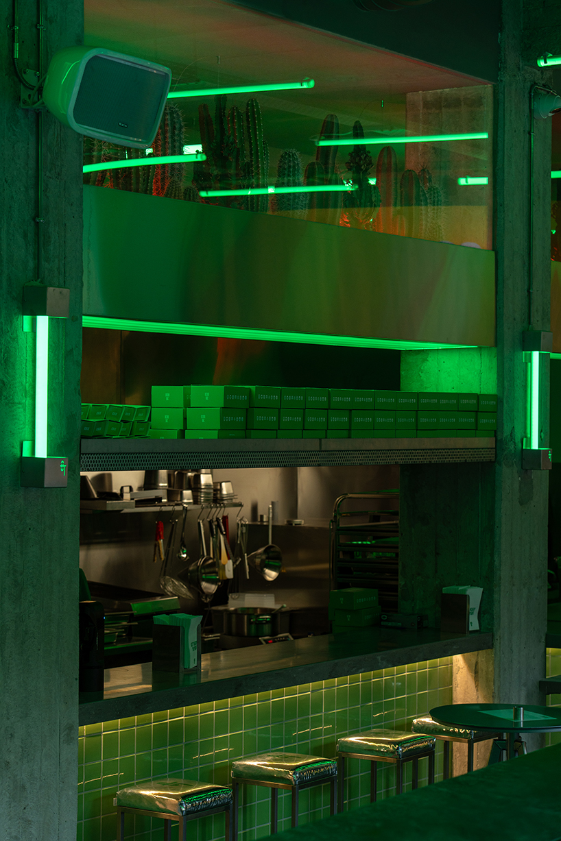 studiomateriality translates lucha libre into green-lit, stainless-steel bar in athens - 4