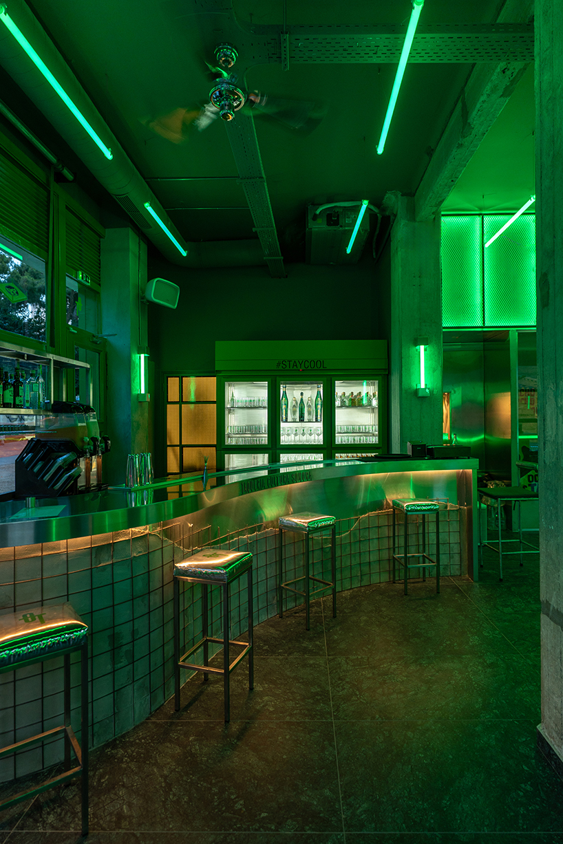 studiomateriality translates lucha libre into green-lit, stainless-steel bar in athens - 3