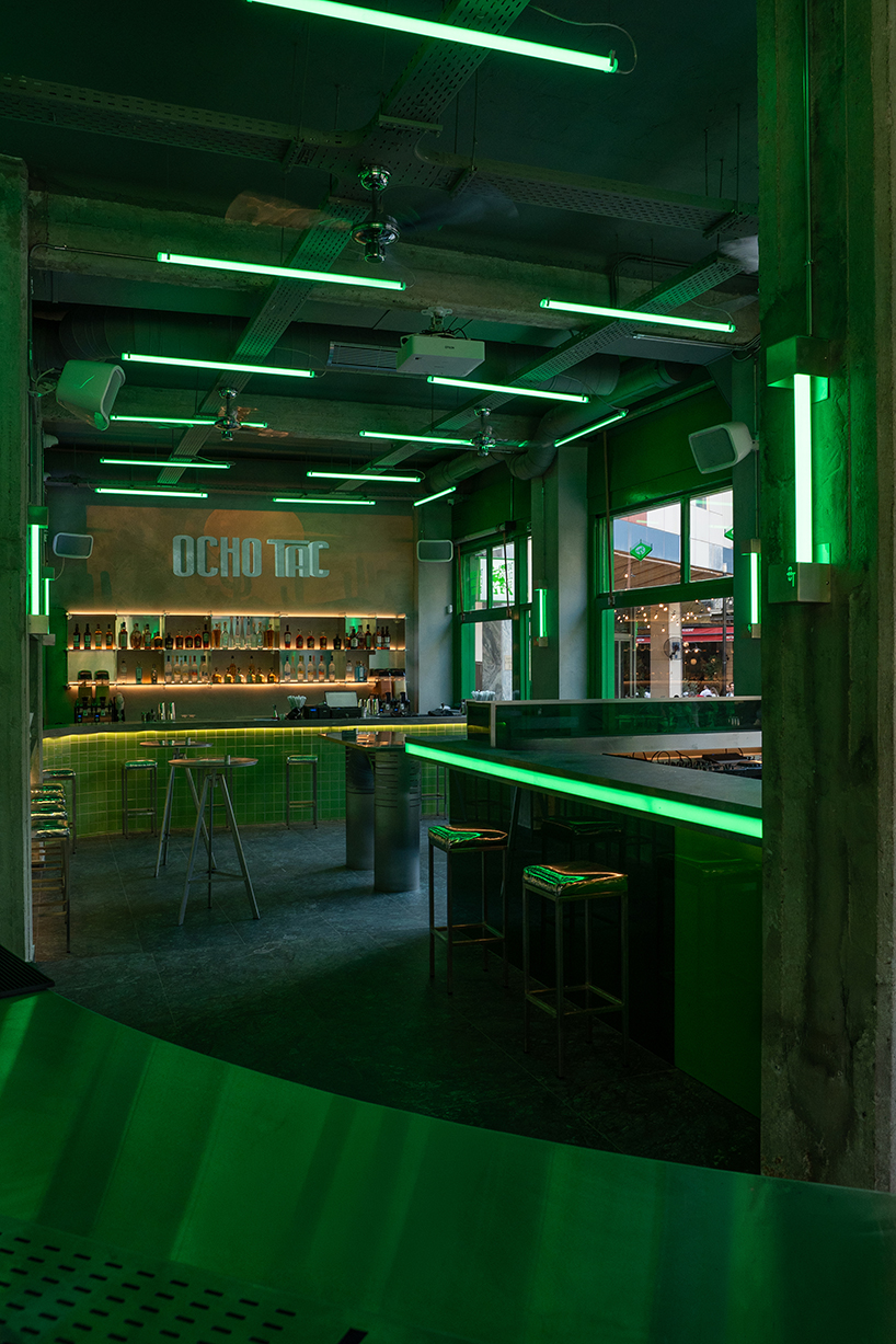 studiomateriality translates lucha libre into green-lit, stainless-steel bar in athens - 2