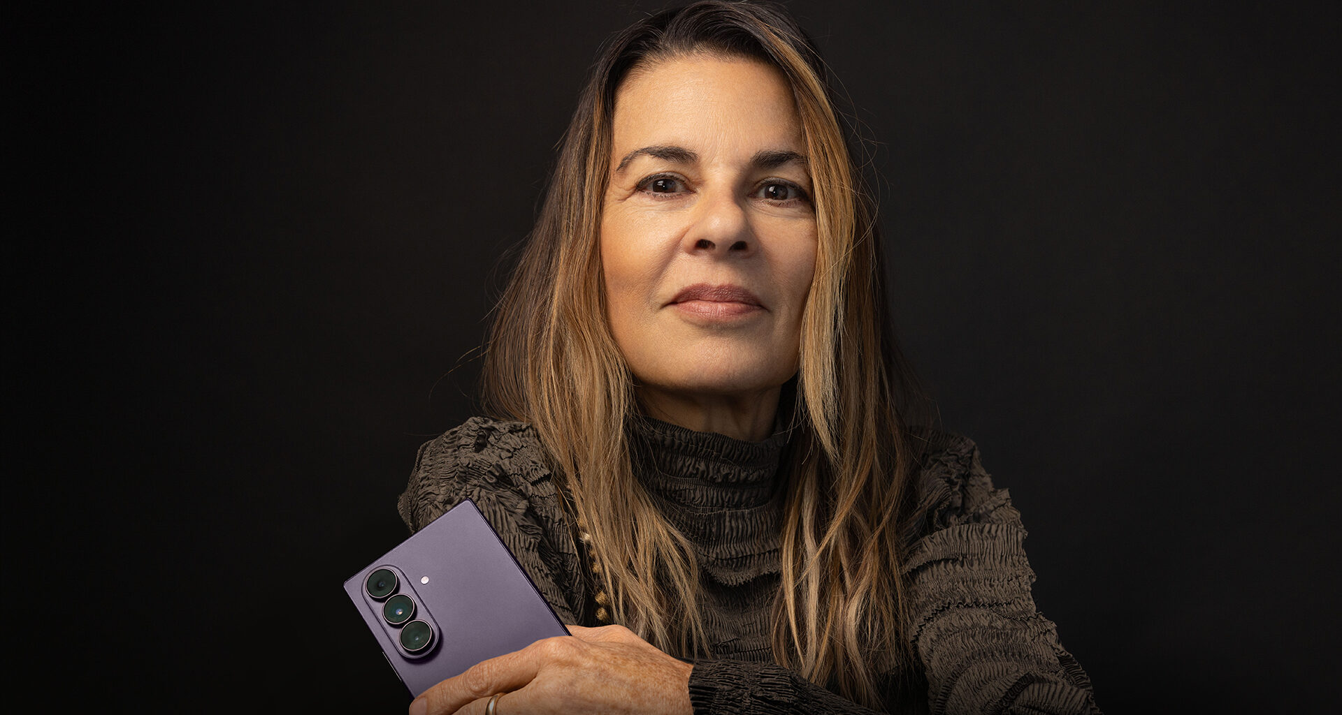 Clinical psychologist Dr. Orna Guralnik with a purple Galaxy Z Fold8 Ultra.