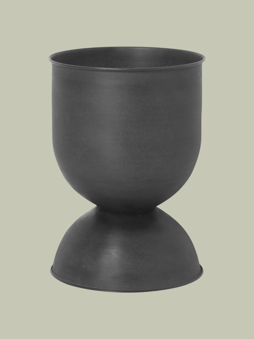 A matte black hourglass plant pot from Ferm Living