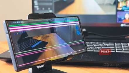 Samsung Galaxy Note 20 Ultra on a phone holder with a HP laptop in the background