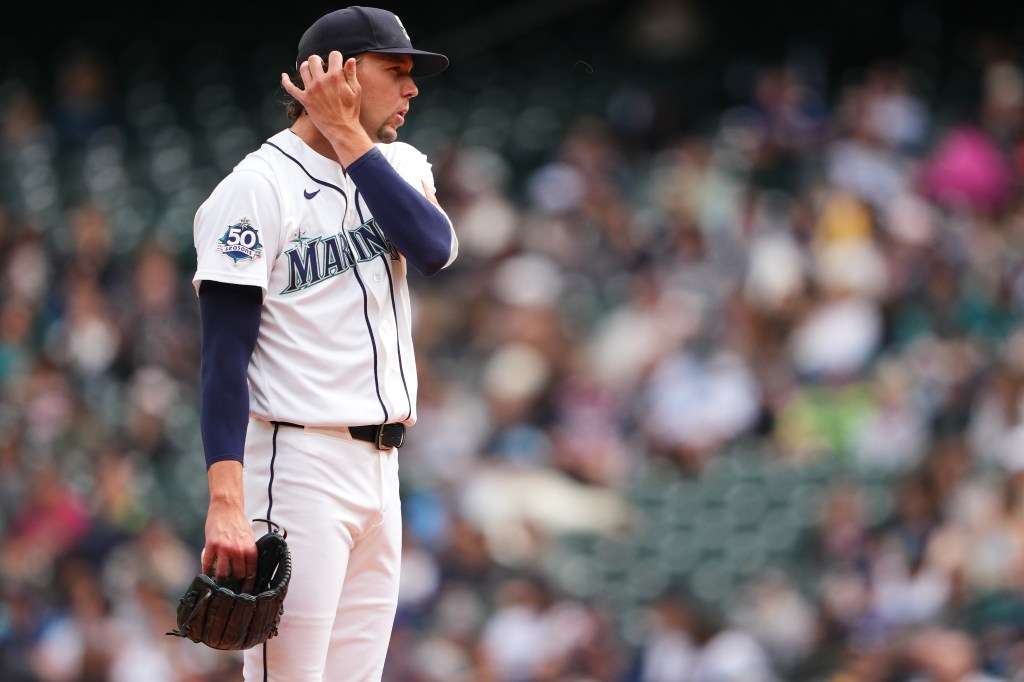 Seattle Mariners pitcher Logan Gilbert reacts after giving up a home run.