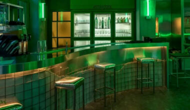 studiomateriality translates lucha libre into green-lit, stainless-steel bar