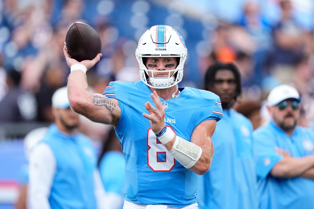 Tennessee Titans quarterback Will Levis warms up before a preseason game.