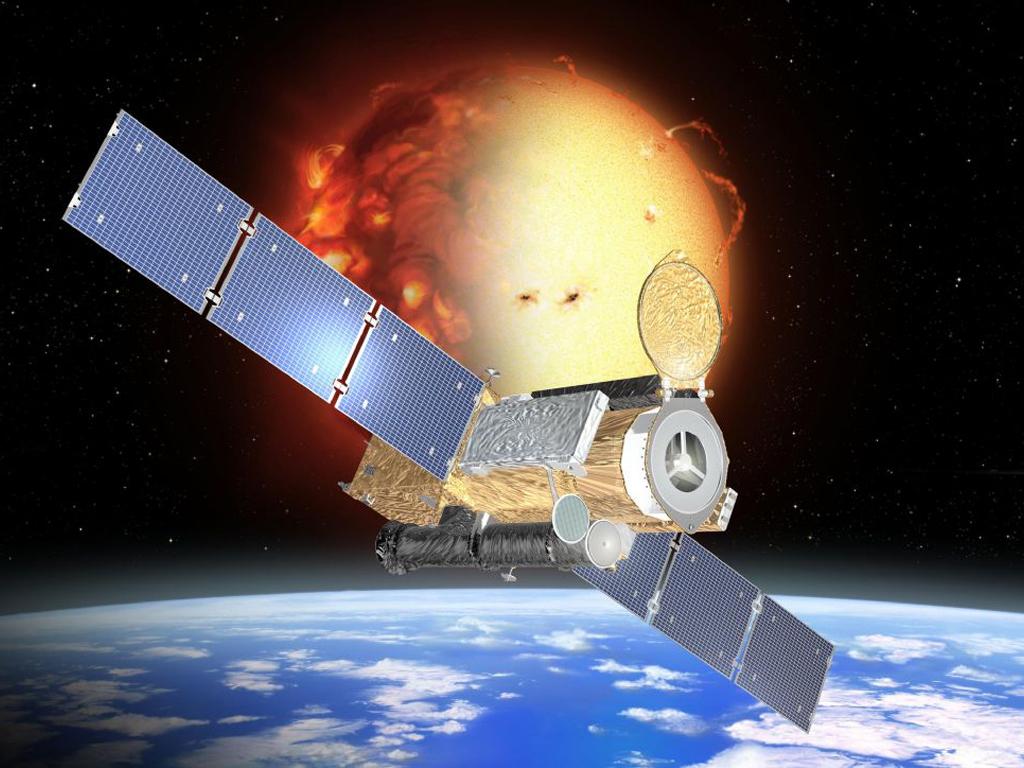 An artist's concept of the Hinode spacecraft in its low orbit around Earth during the sun's uneclipsed activity.