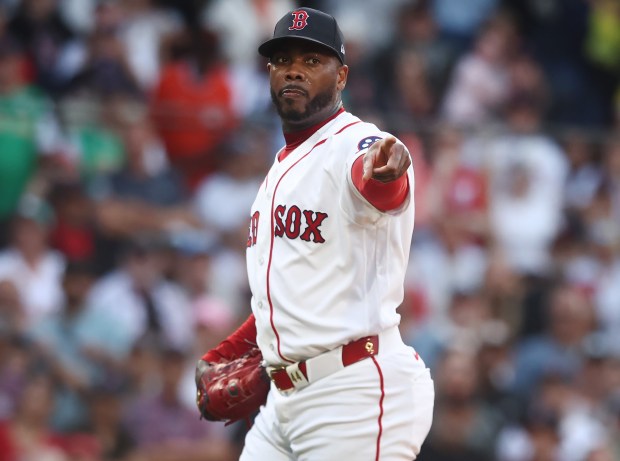 Boston, MA - Boston Red Sox pitcher Aroldis Chapman points to first for a call during the 9th inning of the game at Fenway Park. (Nancy Lane/Boston Herald)