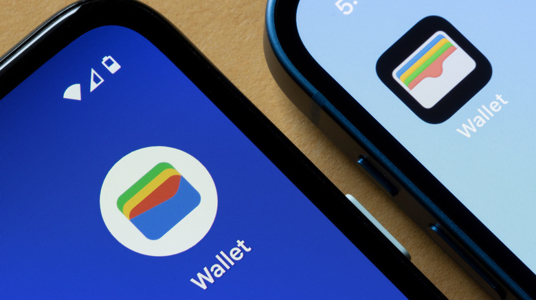 The Google Wallet app logo, shown close up on two Android smartphones.