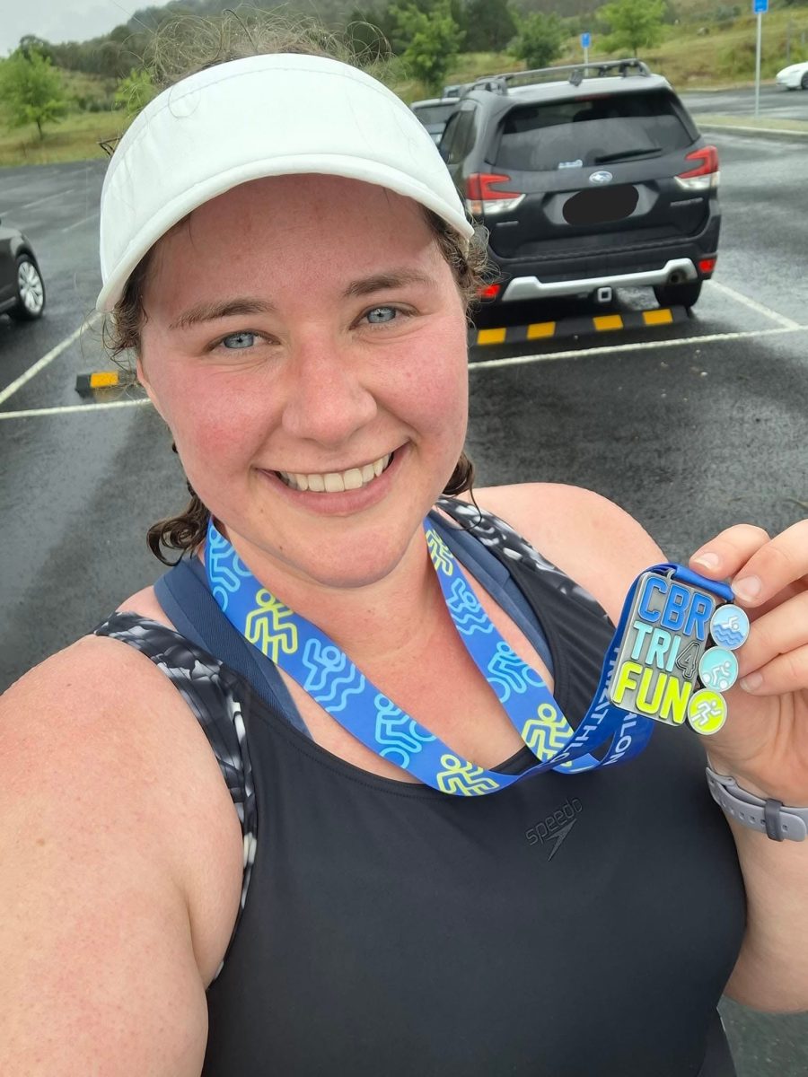 A woman finishes a triathlon
