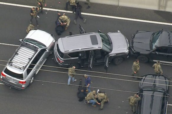 Specialist police surround the stolen vehicle. 