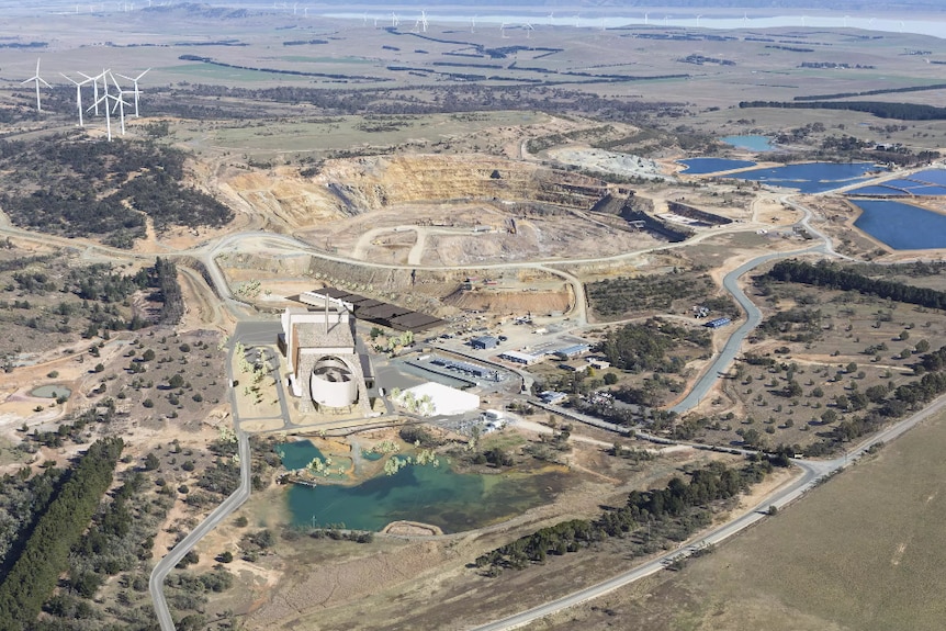 Aerial view of the landfill with artist depiction of the energy plant