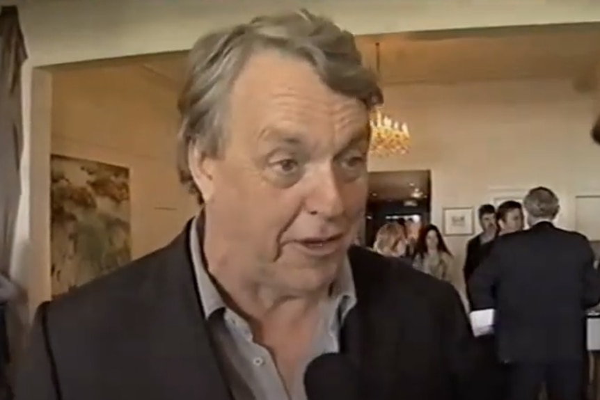 Mike Brady being interviewed about his famed football anthem in 2002.