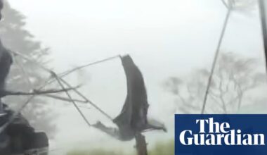 High winds sweep away tables and chairs outside New South Wales cafe – video | Australia weather
