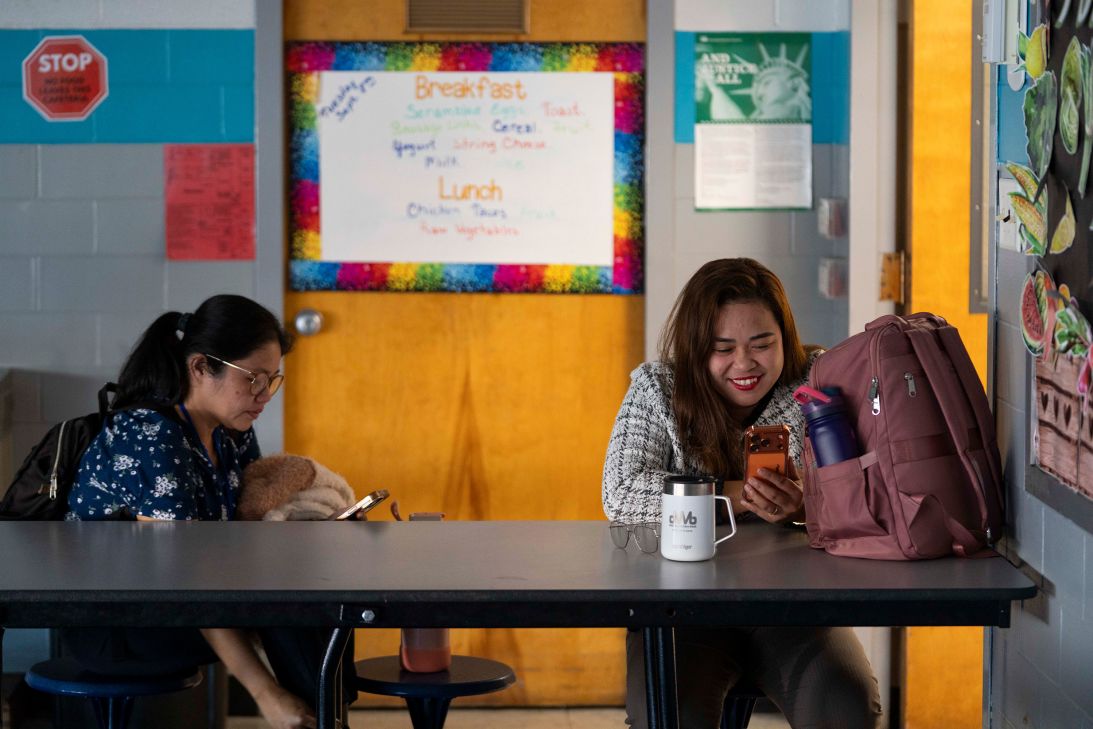 Leah Mae Bauyot and Zaira Chinte call the Philippines to speak with family after school ends in Hettinger, North Dakota. Video calls and text messages help them stay in touch across the miles and the time zones.