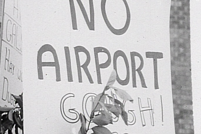 A black and white image of a sign reading no airport