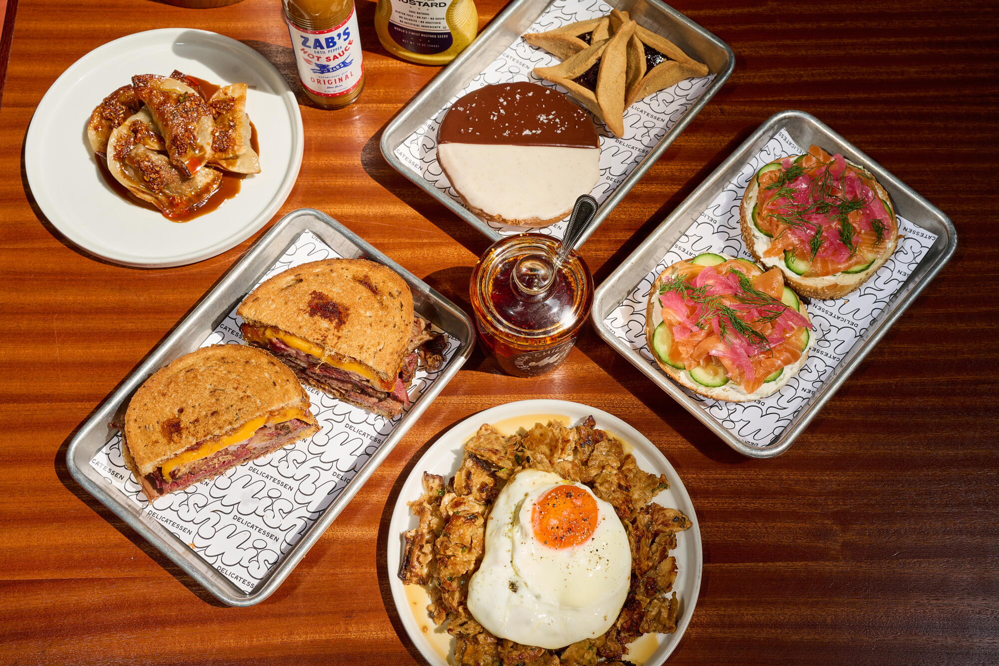 Dishes Mish Delicatessen including bagels, matzo brie, cookies, kreplach and sandwiches