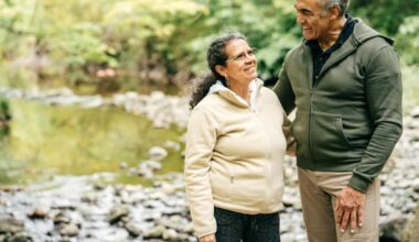 Two seniors walk in the forest