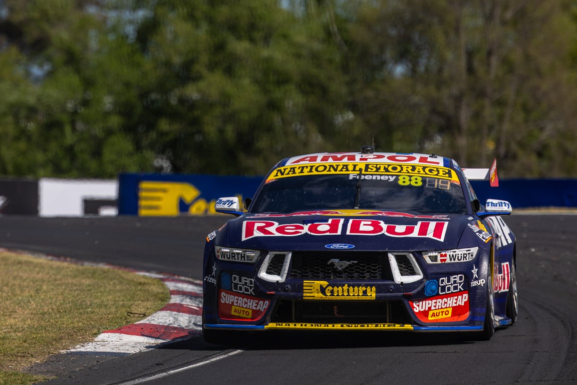 Blue number 88 Red Bull Ford Mustang Supercars car cornering at Bathurst.