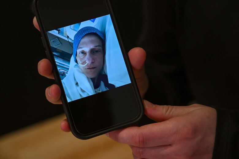 Jasper shows a photo of himself when he was hospitalized in January.