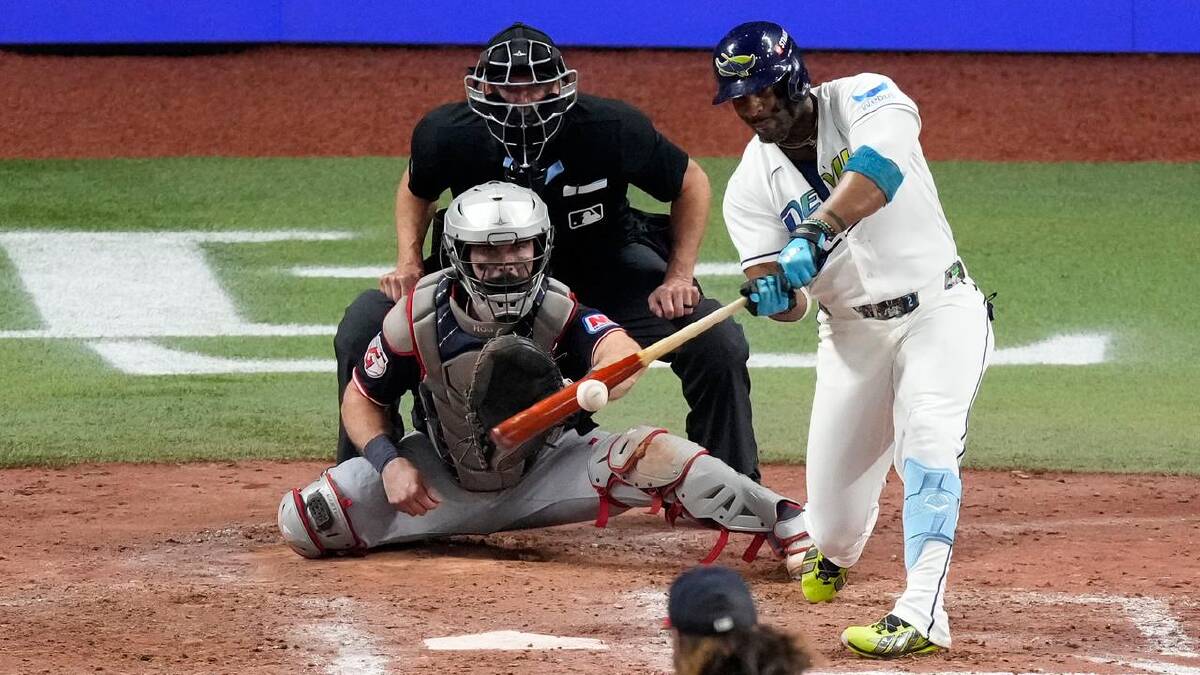 Yandy Diaz launches the first of two Rays two-run homers against Cleveland. (AP PHOTO)