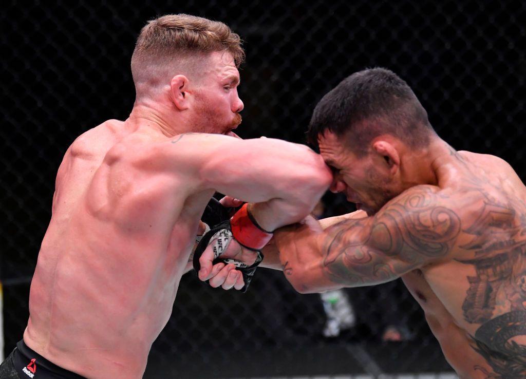 Paul Felder elbows Rafael Dos Anjos of Brazil in a lightweight fight during the UFC Fight Night event at UFC APEX on November 14, 2020 in Las Vegas, Nevada.