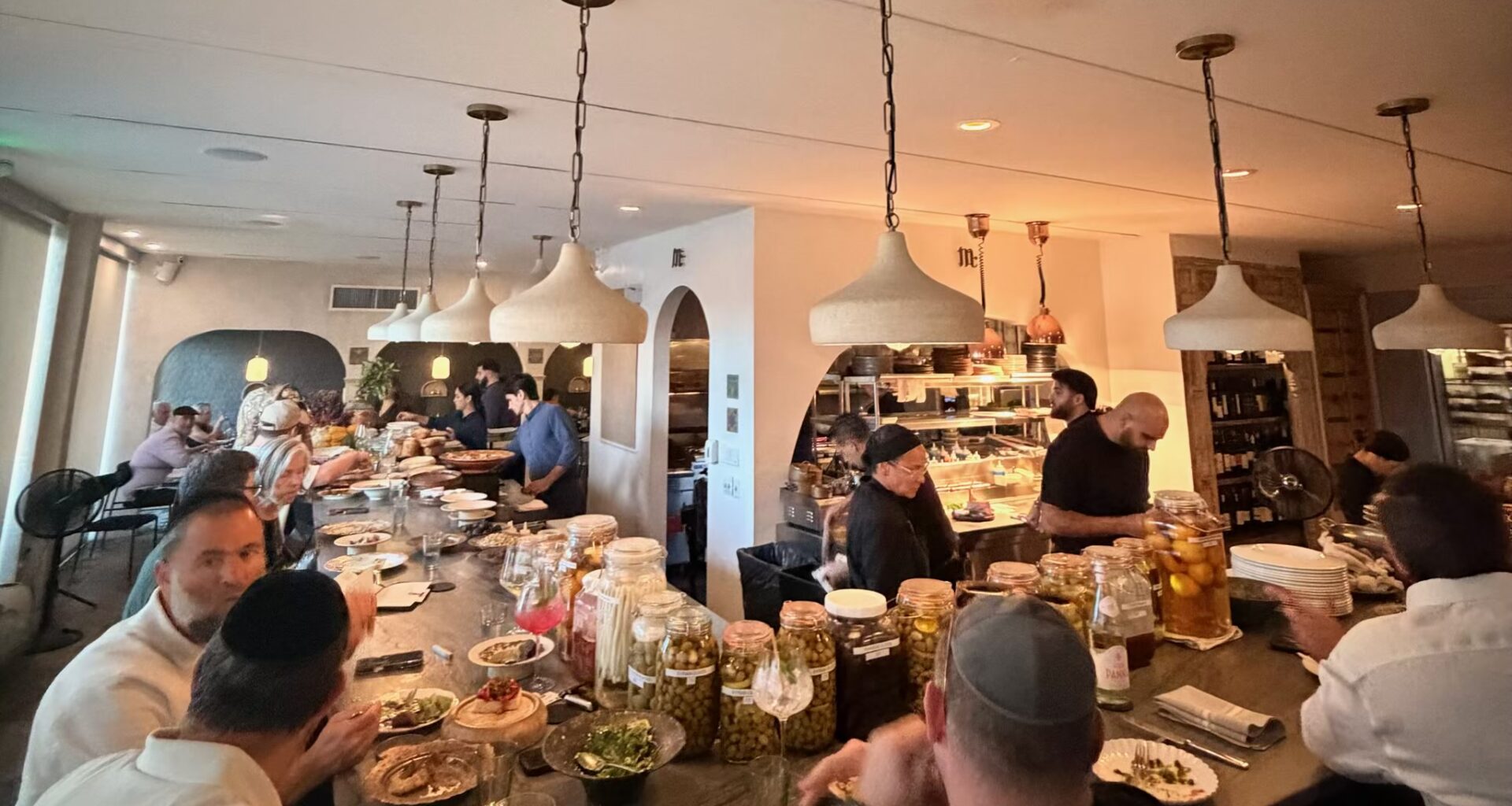 Guests dining at the chef's counter at Mutra in North Miami