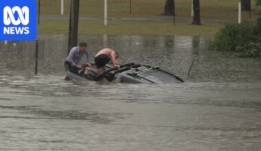 ABC reporter and bystander rescue man from sinking car in floodwaters near Brisbane