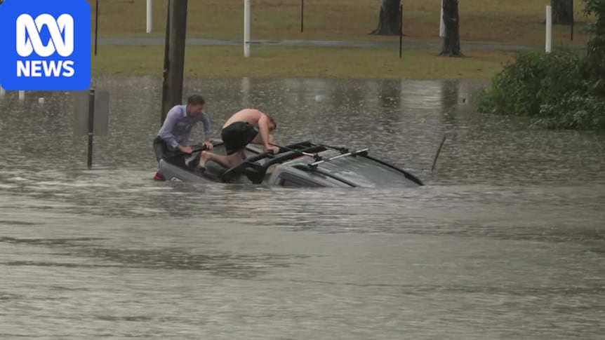 ABC reporter and bystander rescue man from sinking car in floodwaters near Brisbane