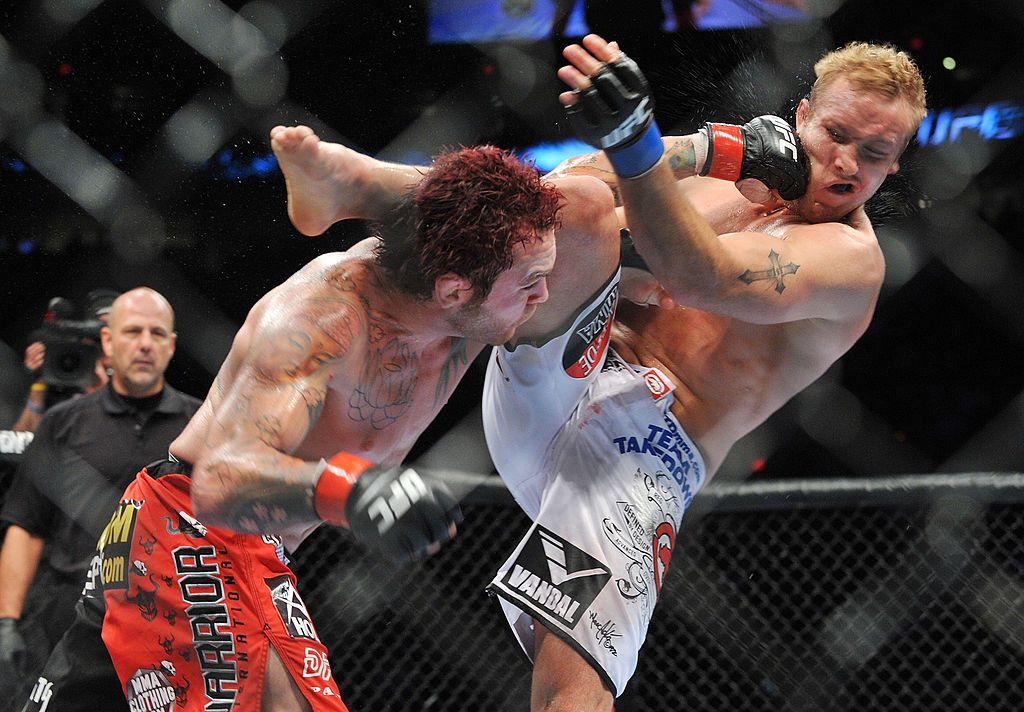 UFC fighter Chris Leben (L) battles UFC fighter Jake Rosholt (R) during their Middleweight bout at UFC 102: Couture vs. Nogueira at the Rose Garden Arena on August 29, 2009 in Portland, Oregon.