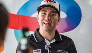 Jarrod Hughes in Erebus Motorsport shirt speaks during a pit lane interview.