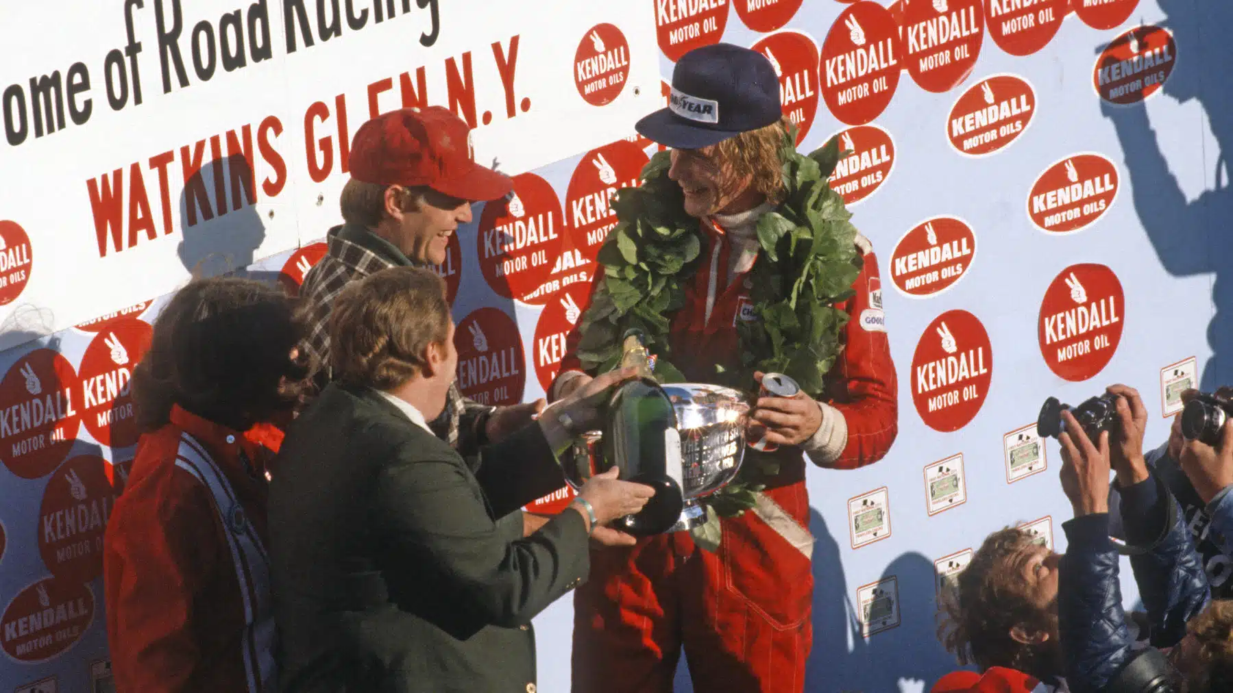James Hunt (McLaren-Mercedes) on the podium after the 1976 United States Grand Prix in Watkins Glen