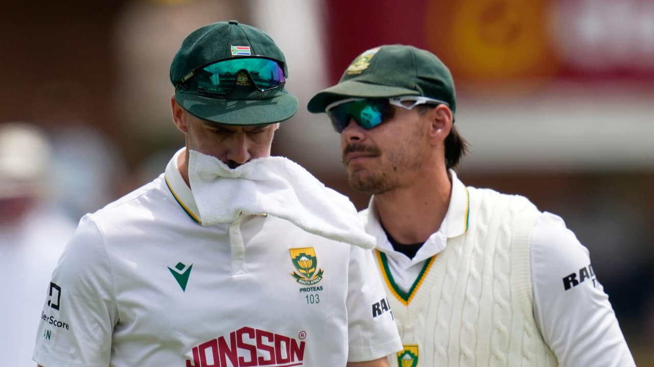 South Africa's Anrich Nortje bites the towel after his over on day four of the second cricket test match between South Africa and Australia.